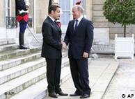 French President Nicolas Sarkozy welcomes Russian Prime Minister Vladimir Putin at the Elysee Palace
