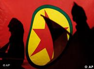 Nov. 12, 2007 file picture, Kurdish demonstrators are silhouetted by a Kurdistan Workers' Party (PKK) flag during a protest in the Cypriot capital of Nicosia