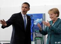 Democratic presidential candidate Sen. Barack Obama, D-Ill., left, waves to the media as he greets with German Chancellor Angela Merkel in Berlin, Thursday, July 24, 2008. 