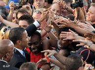 Democratic presidential candidate Sen. Barack Obama, D-Ill., left, shakes hands with supporters after speaking at the Victory Column in Berlin