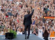 Barack Obama waves as he arrives at the Victory Column in Berlin, Thursday, July 24, 2008