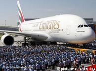 An Airbus A380 with a large crowd assembled to look at it