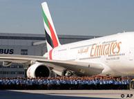 Workers of Airbus accompany the first Airbus A380 plane for the Emirates airline 