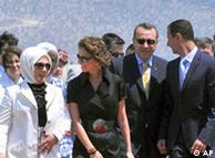 Syrian President Bashar Assad, right, and his wife Asma Assad, second left, are seen with Turkish Prime Minister Recep Tayyip Erdogan, second right, and his wife Emine Erdogan, after their arrival in the Aegean Turkish resort of Bodrum, Turkey, Tuesday, Aug. 5, 2008. The Turkish and Syrian leaders are scheduled to hold talks in the Aegean resort of Bodrum on Tuesday. (AP Photo)