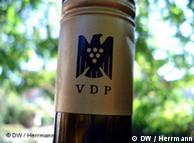 A VDP label around the neck of a wine bottle