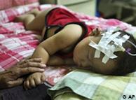 A child suffering from problems related to consuming tainted milk formula rest at a hospital in Shijiazhuang, northern China's Hebei province, Thursday, Sept. 18, 2008. .