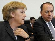 Merkel (e) e o presidente do Bundesbank, Axel Weber