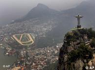 People wave flags at the Christ the redeemer statue in Rio de Janeiro