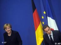 German chancellor Angela Merkel, left and French President, Nicolas Sarkozy, right,  attend a press conference after a France Germany summit at the Charles de Gaulle's museum and memorial on Saturday, Oct. 11, 2008