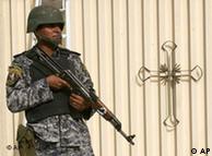 An Iraqi soldier stands guard outside the old easter Church, in Dora district, Baghdad, Iraq