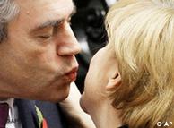 Brown gives Merkel a kiss on the cheek