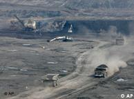 Trucks carry coal from a pit in Cerrejon, Colombia