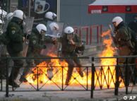 Police in Athens cope with a firebomb