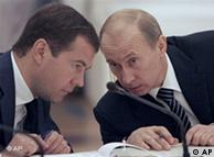 Dmitry Medvedev and Vladimir Putin chatting
