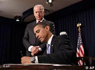 President Barack Obama signs executive orders during a meeting with senior staff, Wednesday, Jan. 21, 2009 
