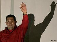 Accompanied by one of his grandsons, Venezuela's President Hugo Chavez waves to supporters at the balcony of Miraflores presidential palace after official results on Sunday's referendum were released in Caracas, Sunday, Feb. 15, 2009. Venezuela's elections chief said Chavez won the referendum to eliminate term limits, paving the way for him to run again in 2012, with 94 percent of the vote counted, 54 percent have backed the president's proposal. (AP Photo/Fernando Llano