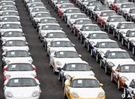 A yard full of Porsche automobiles awaiting export
