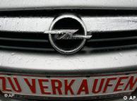 An Opel car with a sign reading 'For Sale' is seen at a car dealer in Bochum