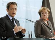 Stern-looking Sarkozy and Merkel at a press conference