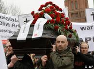 German protestors carry a coffin to symbolize the death of capitalism during a protest in Berlin