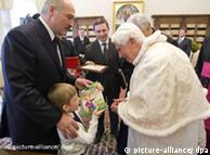 Pope Benedict XVI poses for a photgraph with Belarus President Alexander Lukashenko and his son Nikolai during their meeting at the Vatican, April 27, 2009