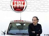 Fiat CEO Sergio Marchionne in front of a Fiat car with logo