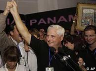 Panama's presidential candidate Ricardo Martinelli clasps hands with his running mate Juan Carlos Varela during his victory speech in Panama City, Sunday, May 3, 2009. Panama's Electoral Tribunal announced the supermarket magnate Martinelli won the Central American nation's presidential elections. (AP Photo/Arnulfo Franco)  Headline: Ricardo Martinelli  Category: I WLD09  Location: Panama City , PAN   Special Instructions:    