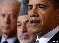 President Barack Obama, accompanied by Vice President Joe Biden, and Afghan President Hamid Karzai