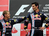 Winner Mark Webber of Australia, right, and second-place finisher Sebastian Vettel of Germany celebrate on the podium 