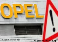 Opel logo and danger ahead traffic sign