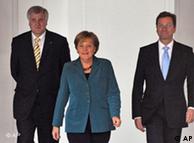 Seehofer, Merkel y Westerwelle, socios de la nueva coalición.