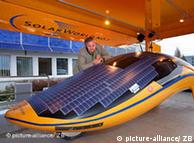 The Solar World No. 1 model has a yellow underbelly, blue solar panels on top, and design that swoops up in the back