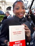 Author Marie NDiaye poses with her award-winning novel