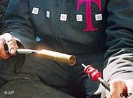 A Deutsche Telekom technician connects a fiber optic cable.