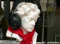 Beethoven bust with earphones and red scarf