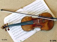 A violin lies on top of sheet music