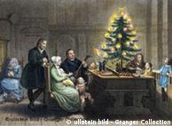 Gemälde mit der Familie Martin Luthers neben einem Weihnachtsbaum (Foto: Ullstein-Bild)