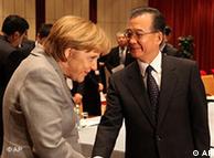 German Chancellor Angela Merkel shakes hand with China's prime minister Wen Jiabao during the UN Climate Summit in Copenhagen