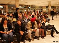 Family and friends wait at Detroit Metropolitan Airport for passengers on Northwest flight from Amsterdam on Friday (Detroit Free Press)