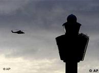 A helicopter circles near the traffic tower of Schiphol airport in Amsterdam