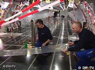 Airbus employees work on an A380 superjumbo