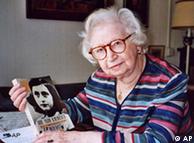 Miep Gies displays a copy of her book 