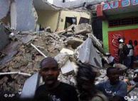 People carry
 an injured person after an earthquake in Port-au-Prince, Haiti, 