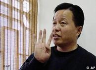 FILE - In this Friday, Feb. 24, 2006 file photo, Gao Zhisheng gestures during an interview at a tea house in Beijing, China. The Chinese human rights lawyer missing for almost a year has been judged by legal authorities and 