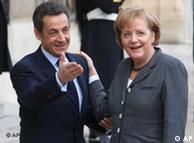 France's President Nicolas Sarkozy, left, welcomes German Chancellor Angela Merkel.