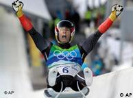 David 
Moeller of Germany celebrates his silver medal finish during the final 
run of the men's singles luge competition