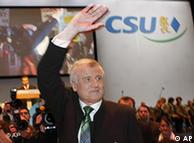 Horst Seehofer waving at a party meeting