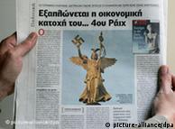 Newspaper showing Siegessäule statue holding a Swastika 
