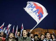Protesters wave union flags and chant slogans during a demonstration outside the Greek Parliament in central Athens, Thursday, March 4, 2010