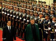 Presidents Hu Jintao and Hamid Karzai inspect the honor guards in Beijing